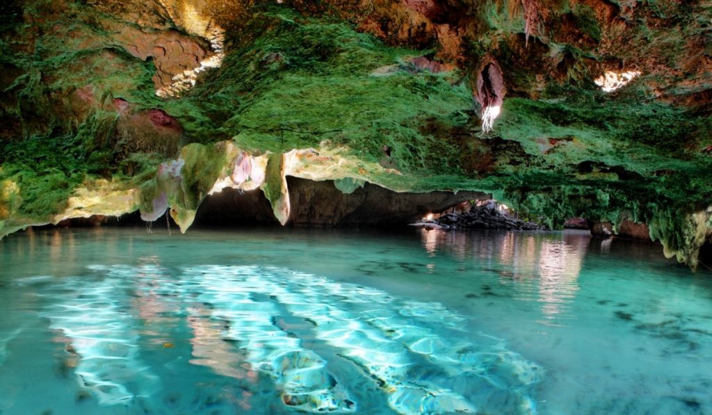 Light blue turquoise water in a large cave.