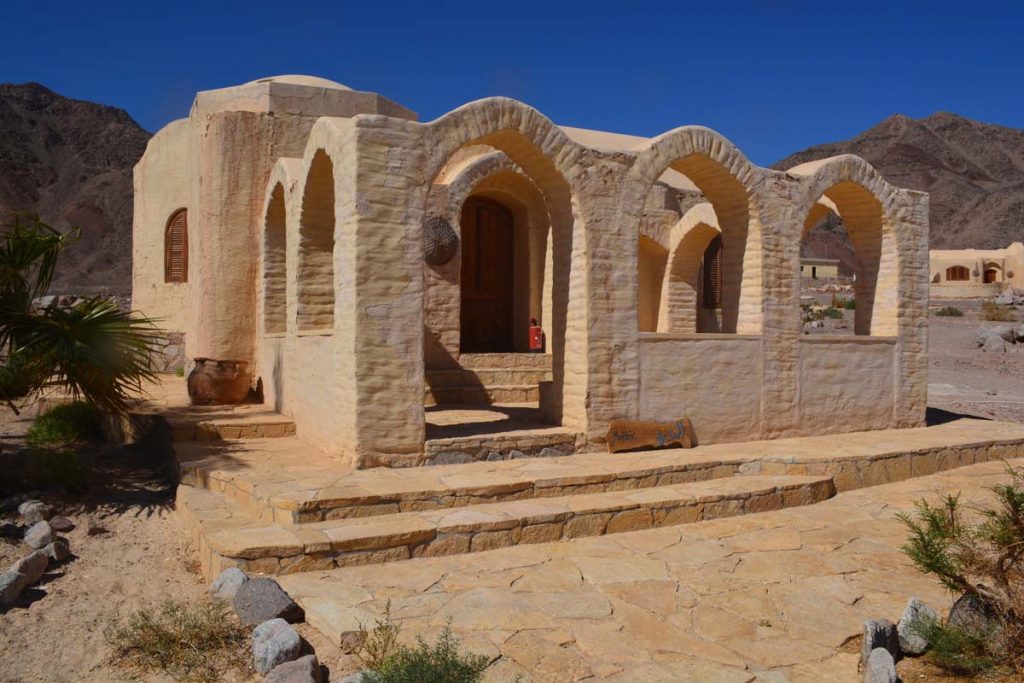 A small house that was built with mud bricks. 