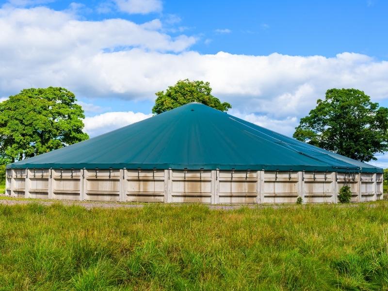 Large tank covered with a green tarp