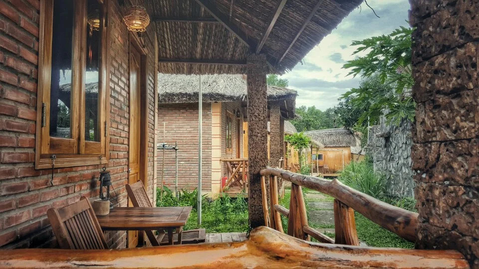 Brick and wooden houses with a porch. 3-4 is right next to each other