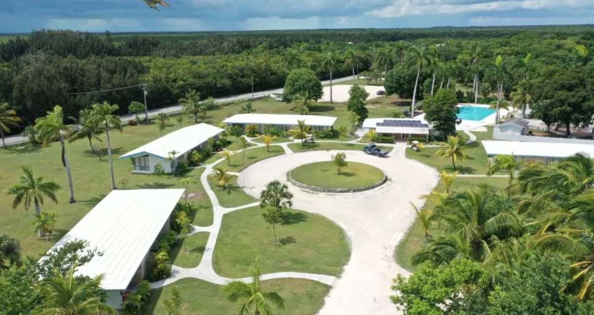 Small buildings connected with pathways in a green garden