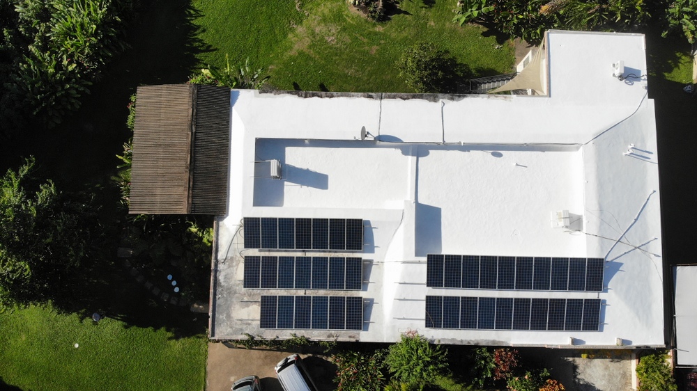 Solar panels on top of a white building