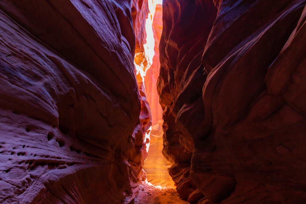 Narrow canyon of red rocks.
