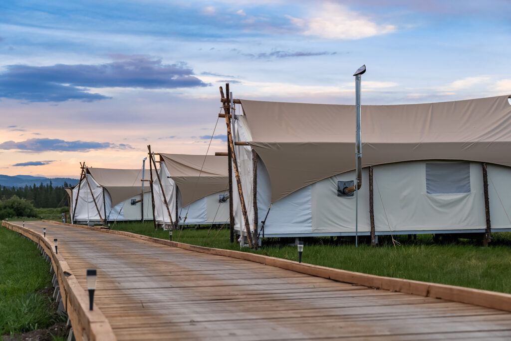 White glamping tents one of the other