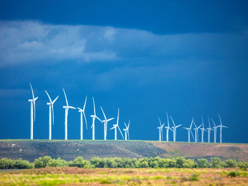 Wind farm blue sky and green plains