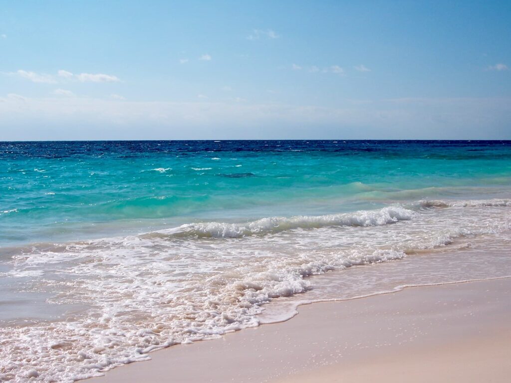 Pink sandy beach with turquoise calm sea