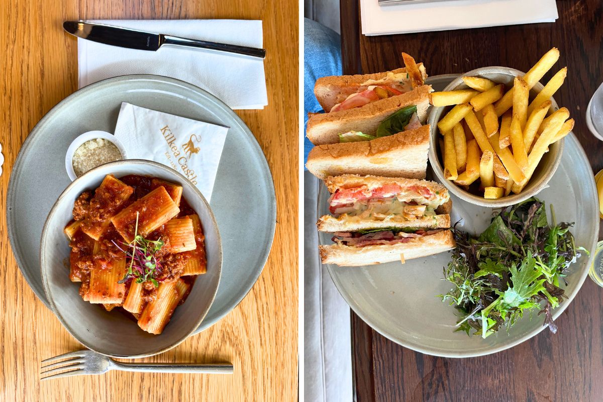 A pasta and a club sandwich nicely plated.